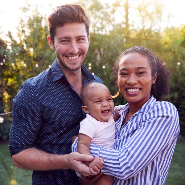family of three smiling